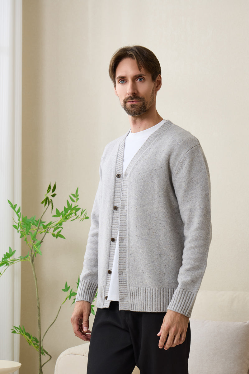 Man wearing an Inis Aran soft gray Donegal merino button cardigan#color_pale-grey