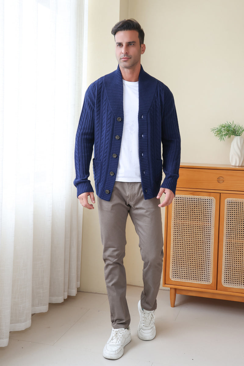Man wearing the Luca Shawl Neck cable cardigan by Inis Aran#color_bright-navy