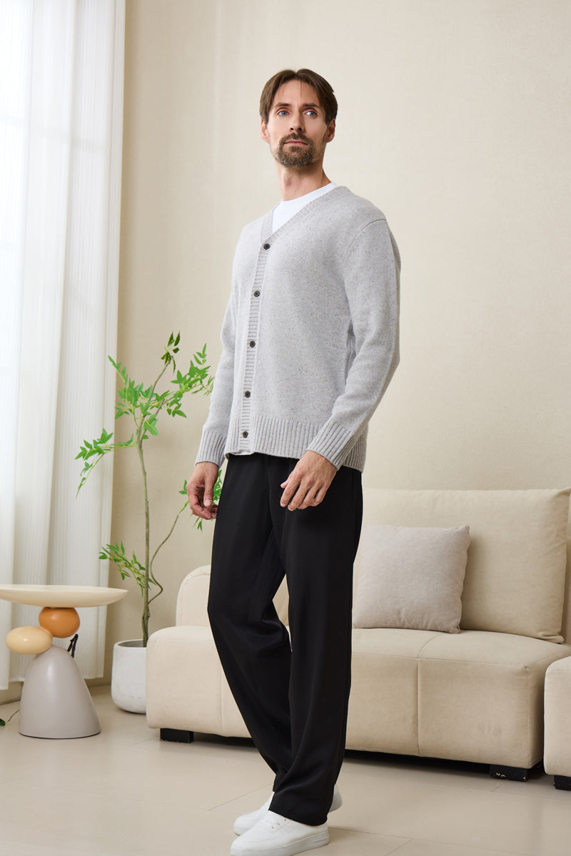 Man wearing an Inis Aran soft gray Donegal merino  button cardigan#color_pale-grey
