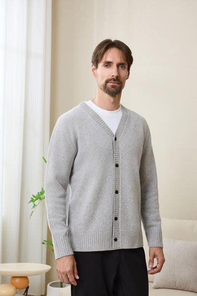 Man wearing an Inis Aran soft gray Donegal merino  button cardigan#color_pale-grey