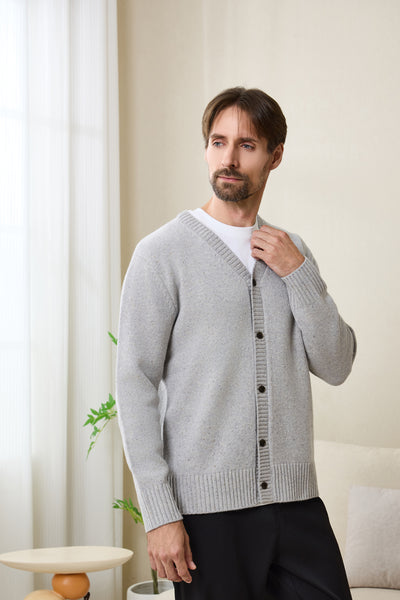 Man wearing an Inis Aran soft gray Donegal merino  button cardigan#color_pale-grey