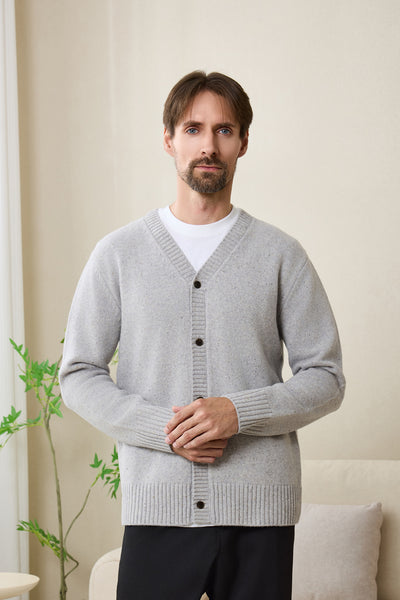 Man wearing an Inis Aran soft gray Donegal merino  button cardigan#color_pale-grey