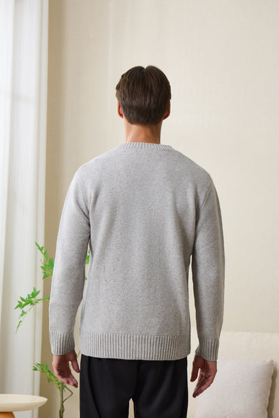 Man wearing an Inis Aran soft gray Donegal merino  button cardigan#color_pale-grey