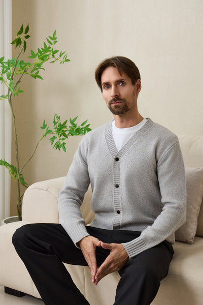 Man wearing an Inis Aran soft gray Donegal merino  button cardigan#color_pale-grey