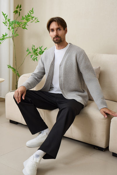 Man wearing an Inis Aran soft gray Donegal merino  button cardigan#color_pale-grey