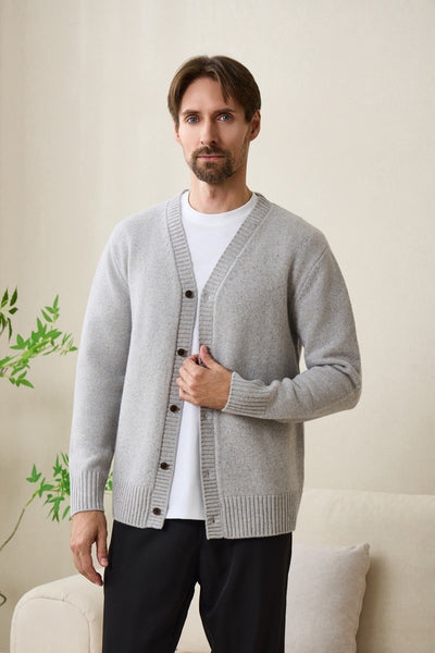 Man wearing an Inis Aran soft gray Donegal merino  button cardigan#color_pale-grey