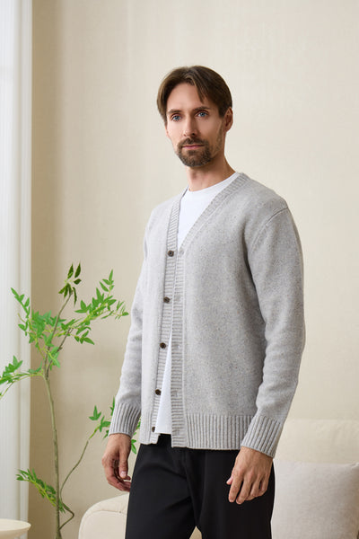 Man wearing an Inis Aran soft gray Donegal merino  button cardigan#color_pale-grey