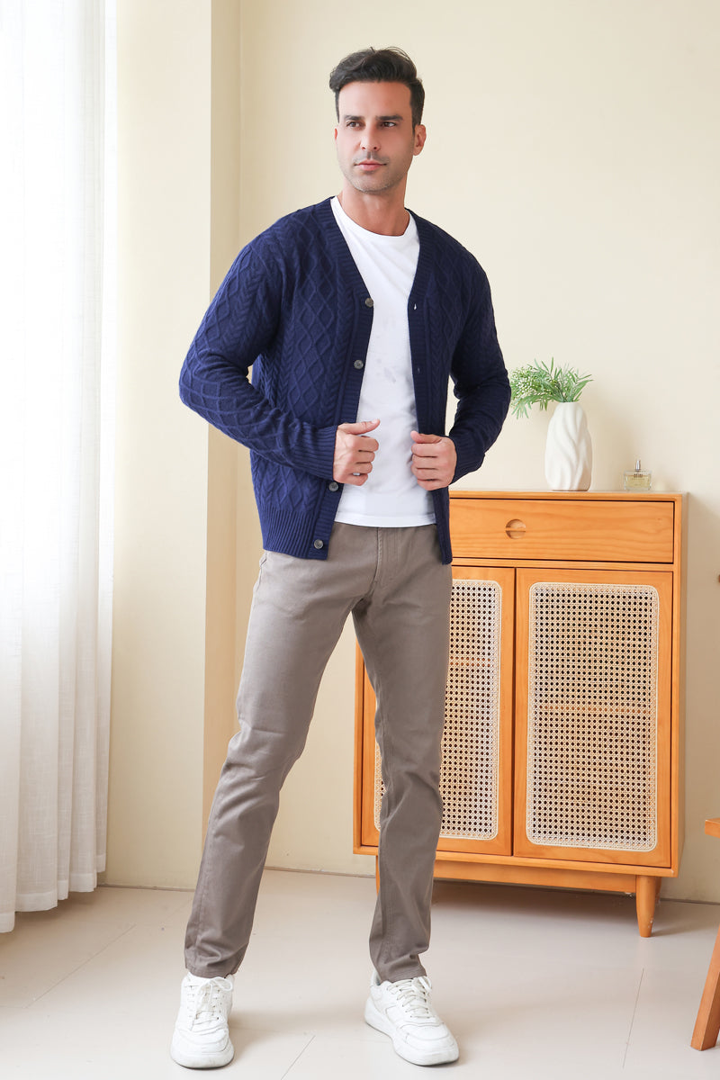 Man wearing an Aran Cable Knit Cardigan by Inis Aran Ireland#color_peacoat-navy