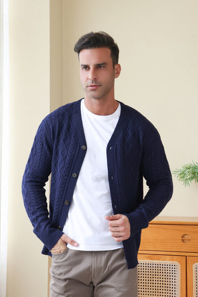 Man wearing an Aran Cable Knit Cardigan by Inis Aran Ireland#color_peacoat-navy