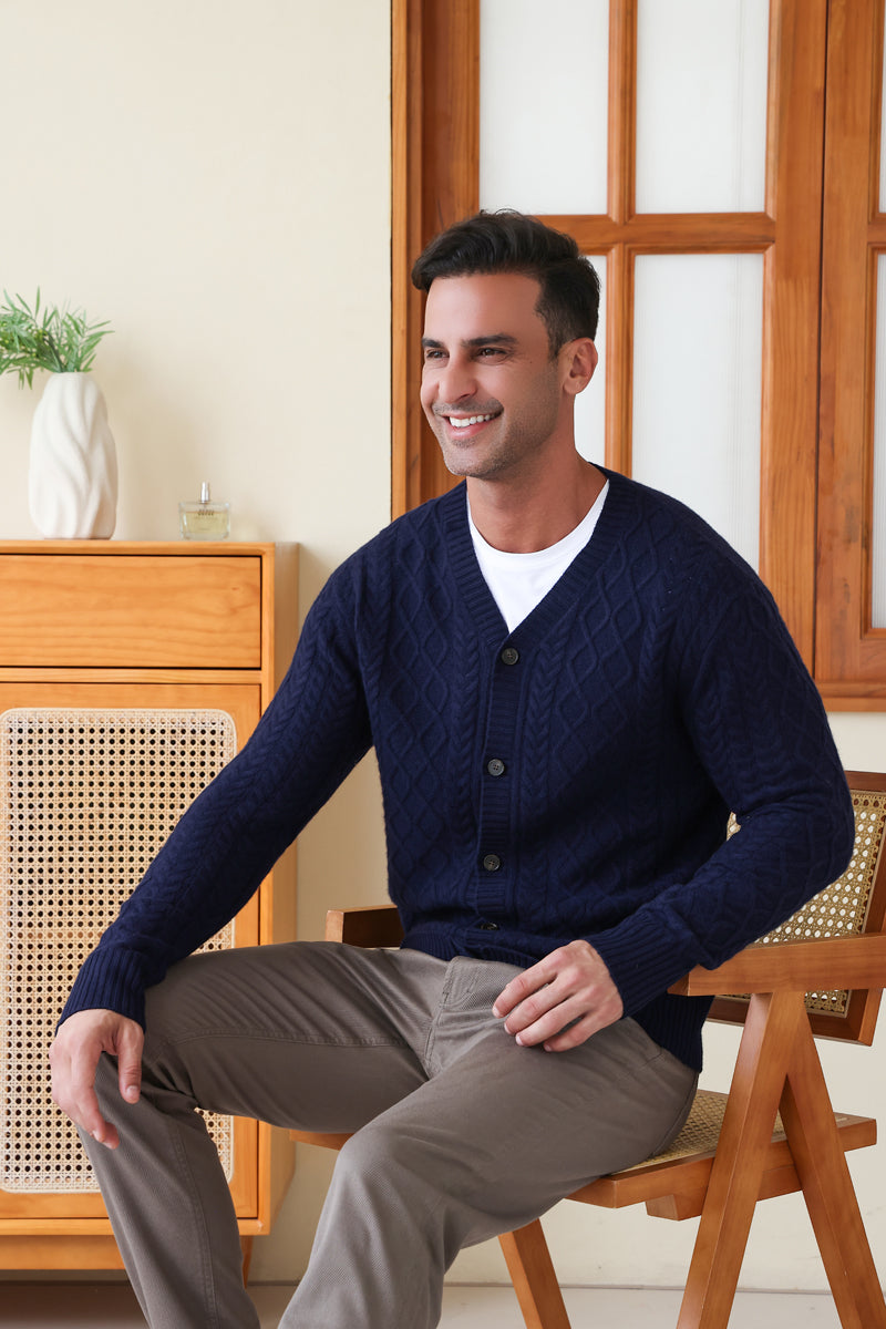 Man wearing an Aran Cable Knit Cardigan by Inis Aran Ireland#color_peacoat-navy
