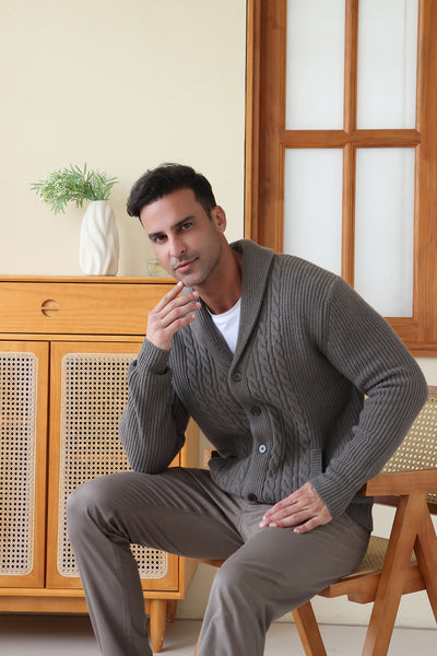 Man wearing the Aran cable shawl neck button cardigan by Inis Aran Ireland#color_grey-oxide