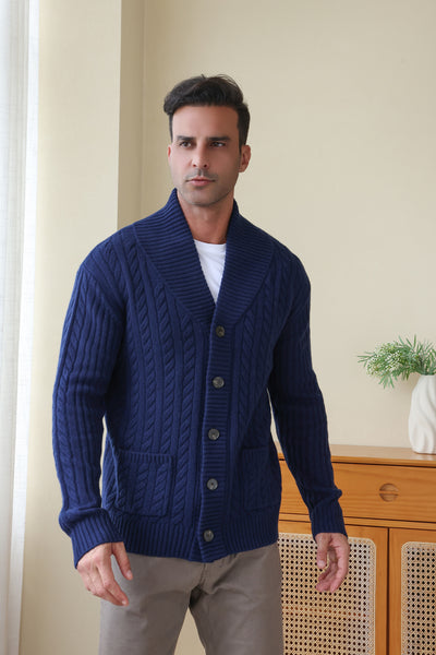 Man wearing the Luca Shawl Neck cable cardigan by Inis Aran#color_bright-navy