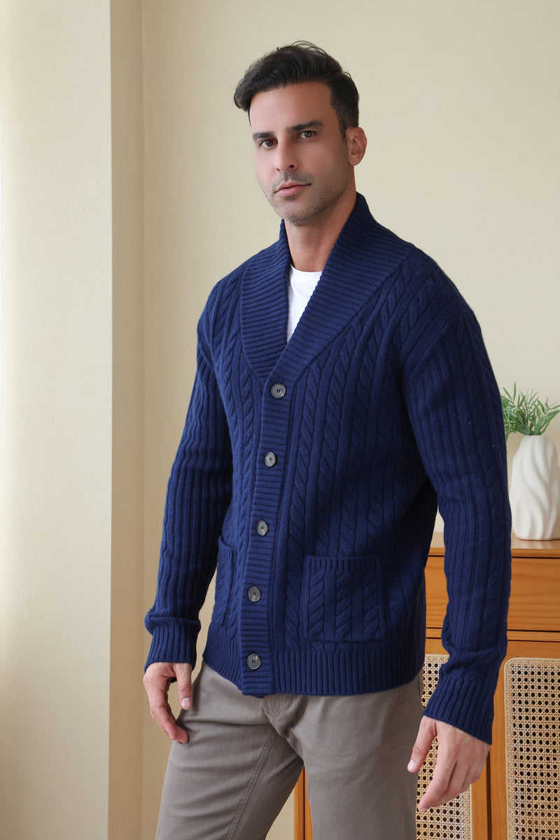 Man wearing the Luca Shawl Neck cable cardigan by Inis Aran#color_bright-navy