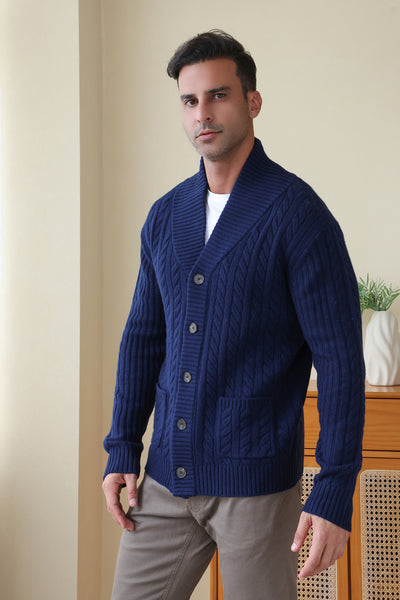 Man wearing the Luca Shawl Neck cable cardigan by Inis Aran#color_bright-navy