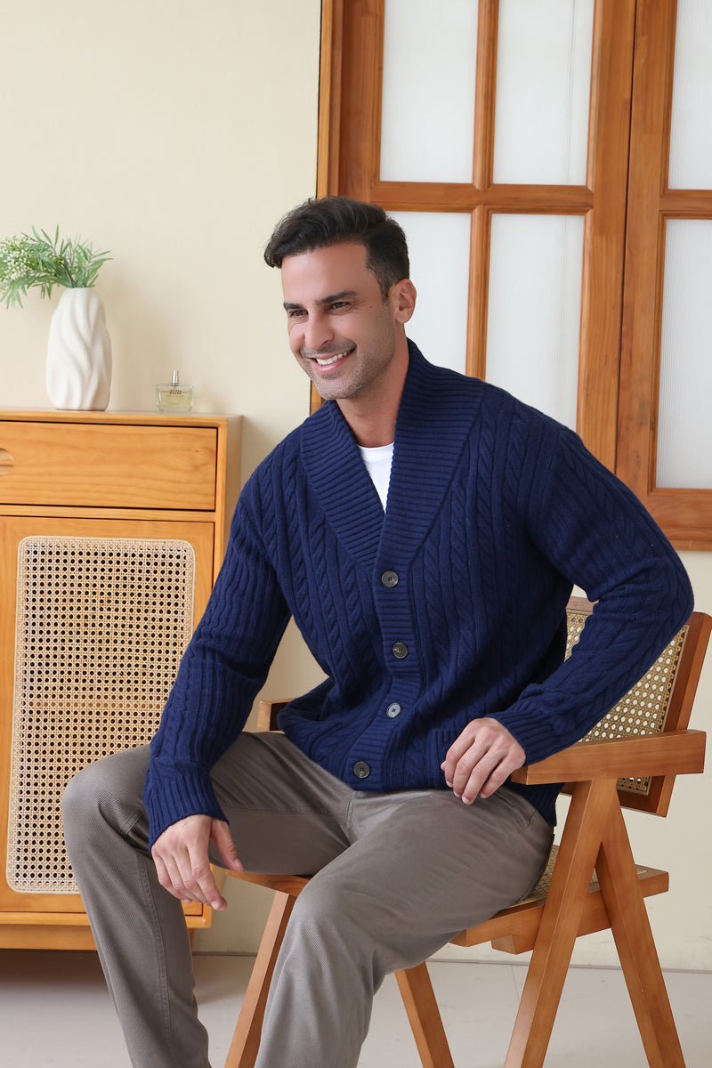 Man wearing the Luca Shawl Neck cable cardigan by Inis Aran#color_bright-navy