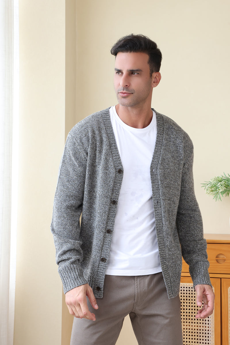 Man wearing the merino twill weave button cardigan by Inis Aran#color_forest-grey