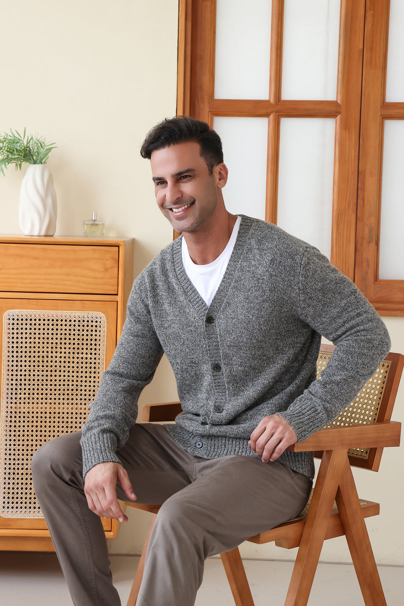 Man wearing the merino twill weave button cardigan by Inis Aran#color_forest-grey