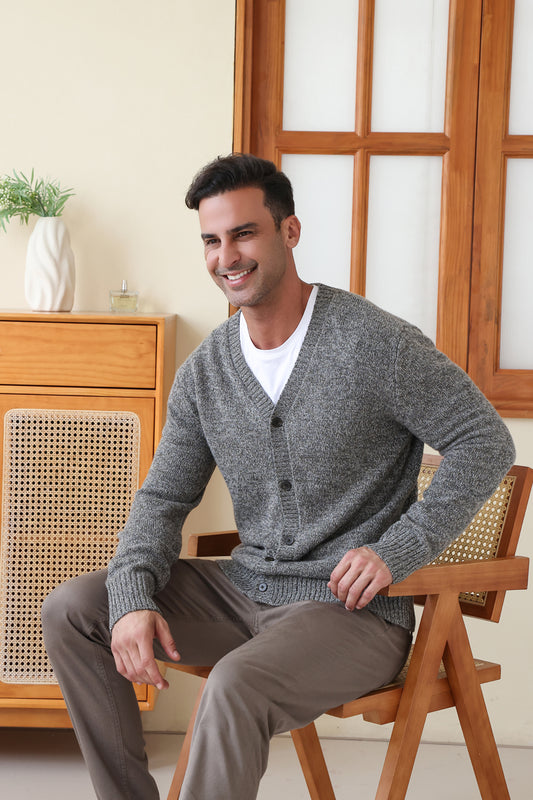 Man wearing the merino twill weave button cardigan by Inis Aran#color_forest-grey