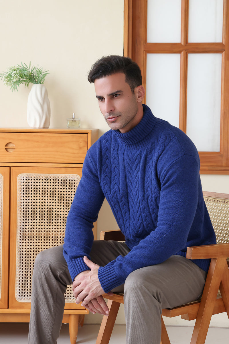 Man wearing a luxurious blue Aran cable knit sweater by Inis Aran Ireland#color_marine