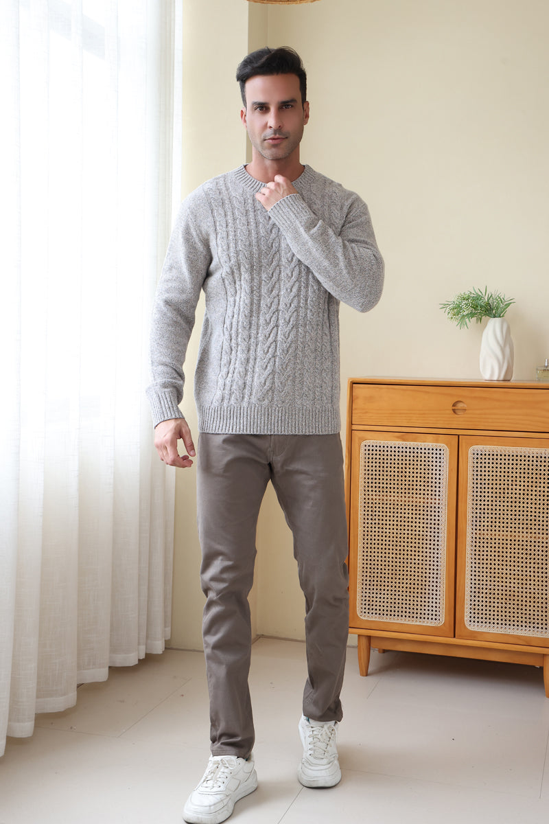 Man wearing a luxurious merino cable knit aran sweater in a twill weave#color_stone