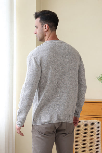 Man wearing a luxurious merino cable knit aran sweater in a twill weave#color_stone