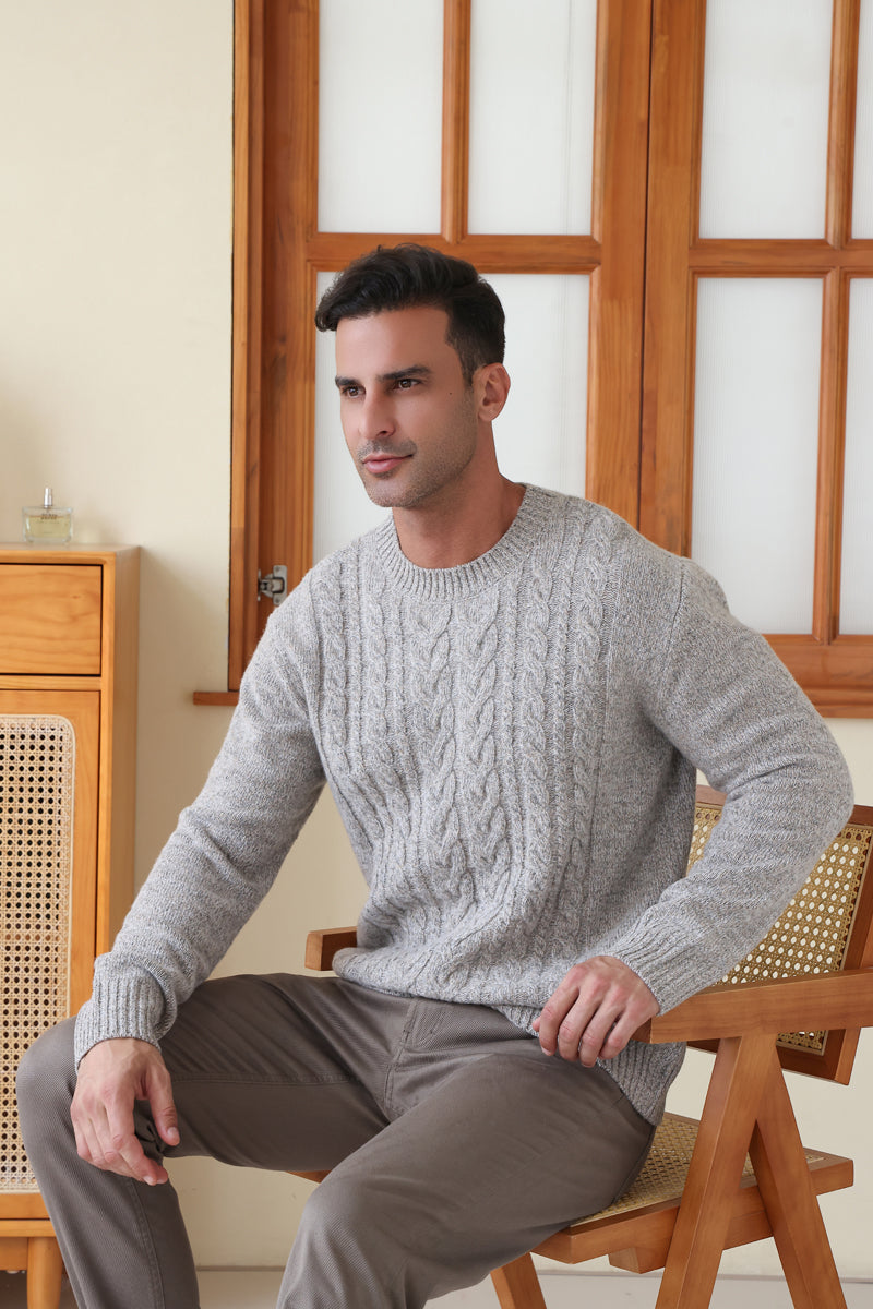 Man wearing a luxurious merino cable knit aran sweater in a twill weave#color_stone