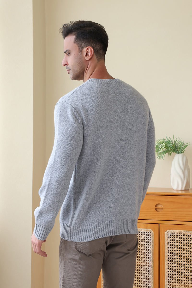Man wearing the Inis Aran Jacob Aran Cable Merino Wool Sweater#color_ashen