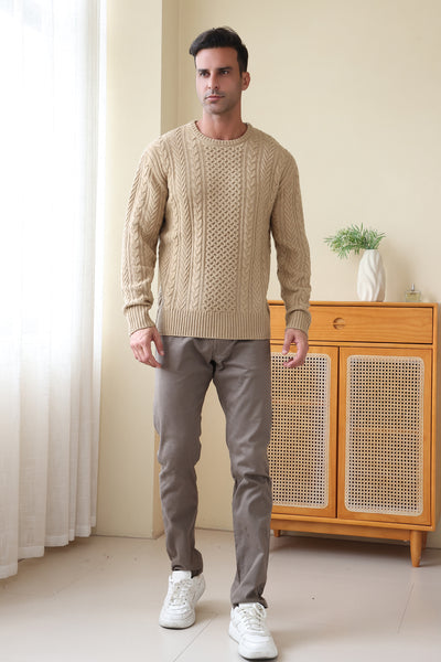 Man wearing a luxury merino aran knit sweater by Inis Aran#color_light-camel