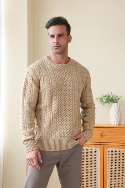 Man wearing a luxury merino aran knit sweater by Inis Aran#color_light-camel