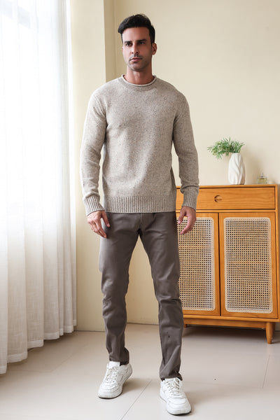 Man wearing the Inis Aran Donegal Merino Roll Neck Sweater#color_ryewater