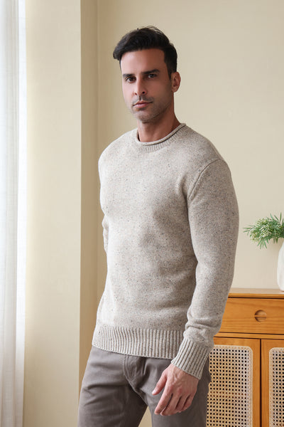 Man wearing the Inis Aran Donegal Merino Roll Neck Sweater#color_ryewater