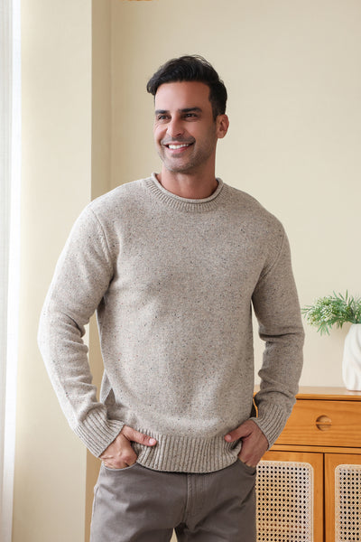 Man wearing the Inis Aran Donegal Merino Roll Neck Sweater#color_ryewater