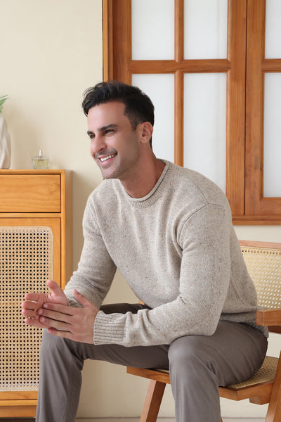 Man wearing the Inis Aran Donegal Merino Roll Neck Sweater#color_ryewater
