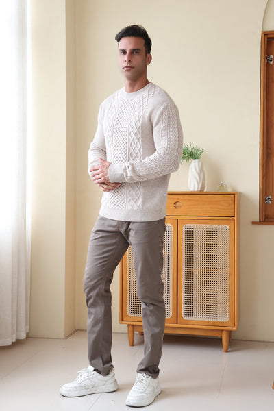 Man wearing a luxury aran cashmere cable knit sweater by Inis Aran Ireland#color_seoul-beige