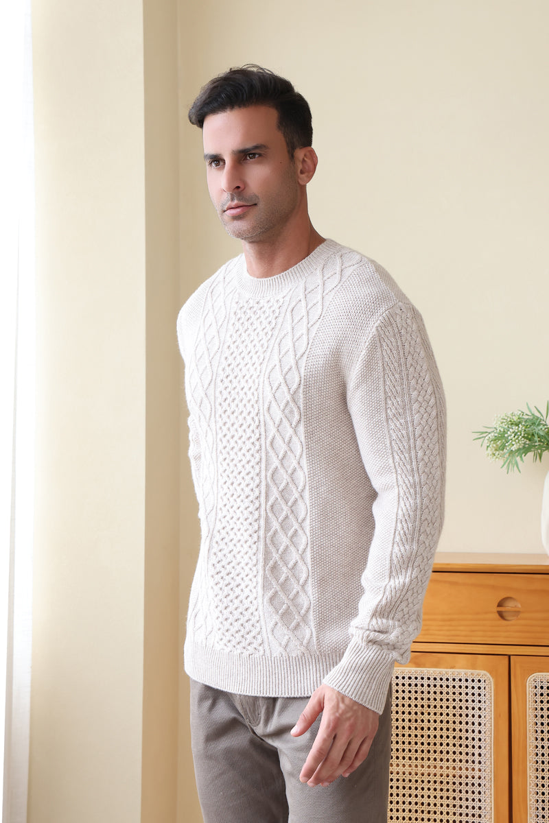 Man wearing a luxury aran cashmere cable knit sweater by Inis Aran Ireland#color_seoul-beige