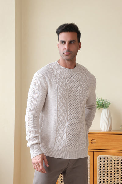 Man wearing a luxury aran cashmere cable knit sweater by Inis Aran Ireland#color_seoul-beige