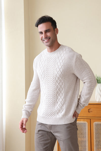 Man wearing a luxury aran cashmere cable knit sweater by Inis Aran Ireland#color_seoul-beige