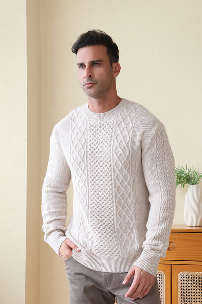 Man wearing a luxury aran cashmere cable knit sweater by Inis Aran Ireland#color_seoul-beige