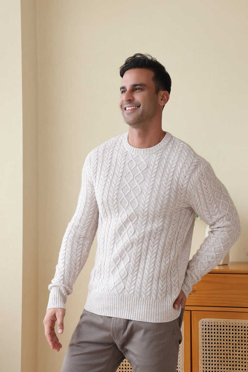 Man wearing a luxury wool cashmere aran sweater by Inis Aran#color_seoul-beige