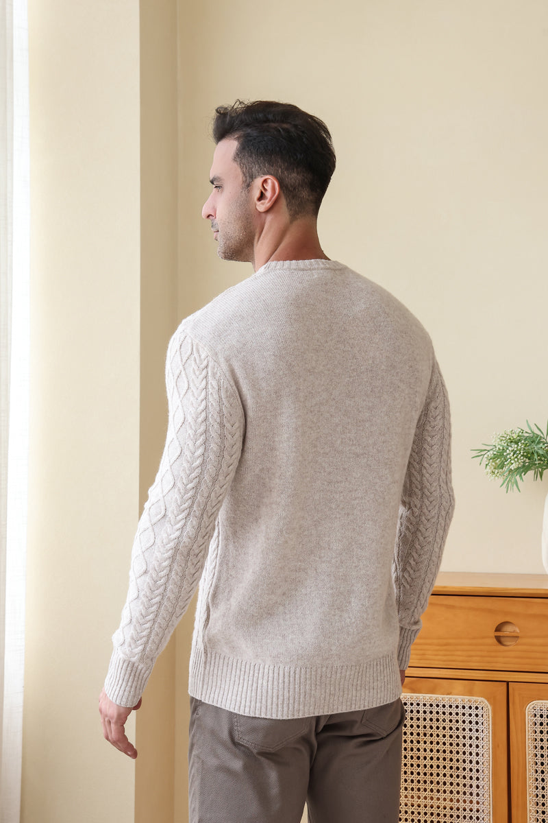 Man wearing a luxury wool cashmere aran sweater by Inis Aran#color_seoul-beige