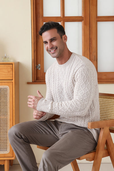 Man wearing a luxury wool cashmere aran sweater by Inis Aran#color_seoul-beige